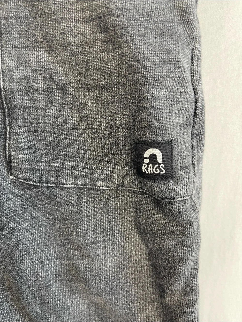 Rags to Raches Charcoal One-Piece Bodysuit with‎ Pink Zip and Tan Pocket
